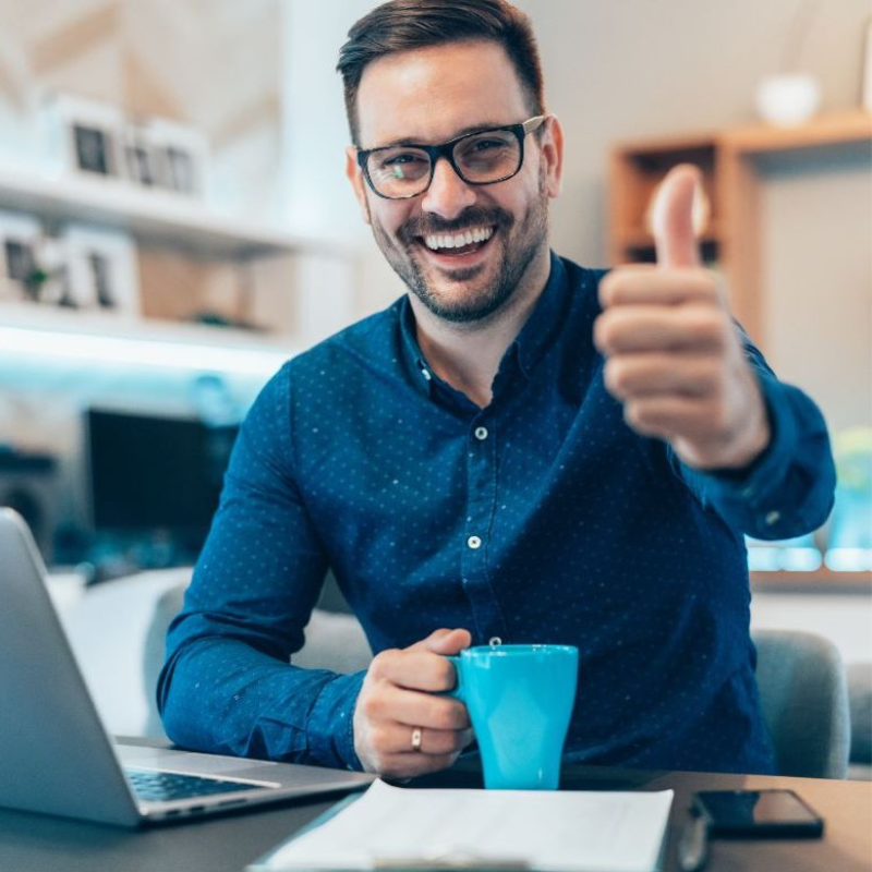 "Ecstatic man happily unboxing his newly acquired refurbished, ex-leased coffee machine, brimming with excitement at the prospect of enjoying freshly brewed coffee."